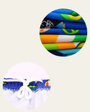 Calção de banho infantil para meninos, modelo 2024, com estampa de dinossauro e tubarão em desenho animado. Ideal para praia e uso casual.